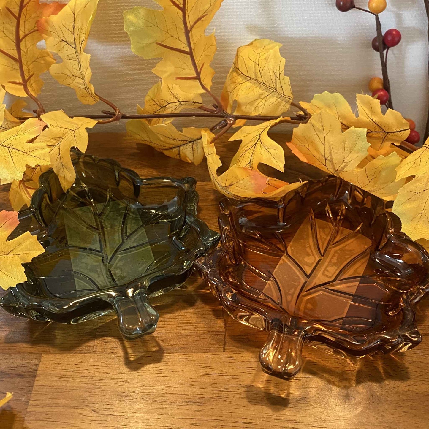 Hazel and Sage glass leaf trinket dishes shown together in brown and green