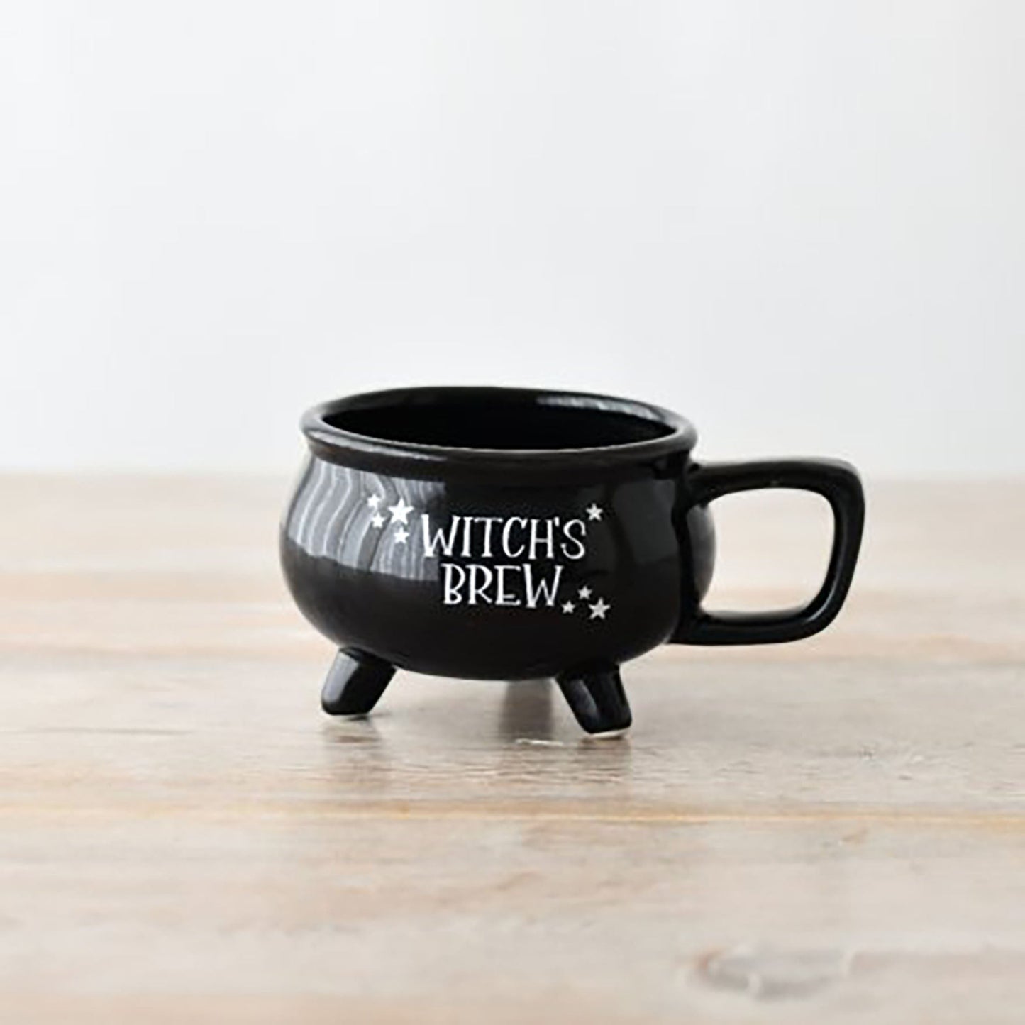 Black glossy Halloween witch's brew mug with gothic lettering design