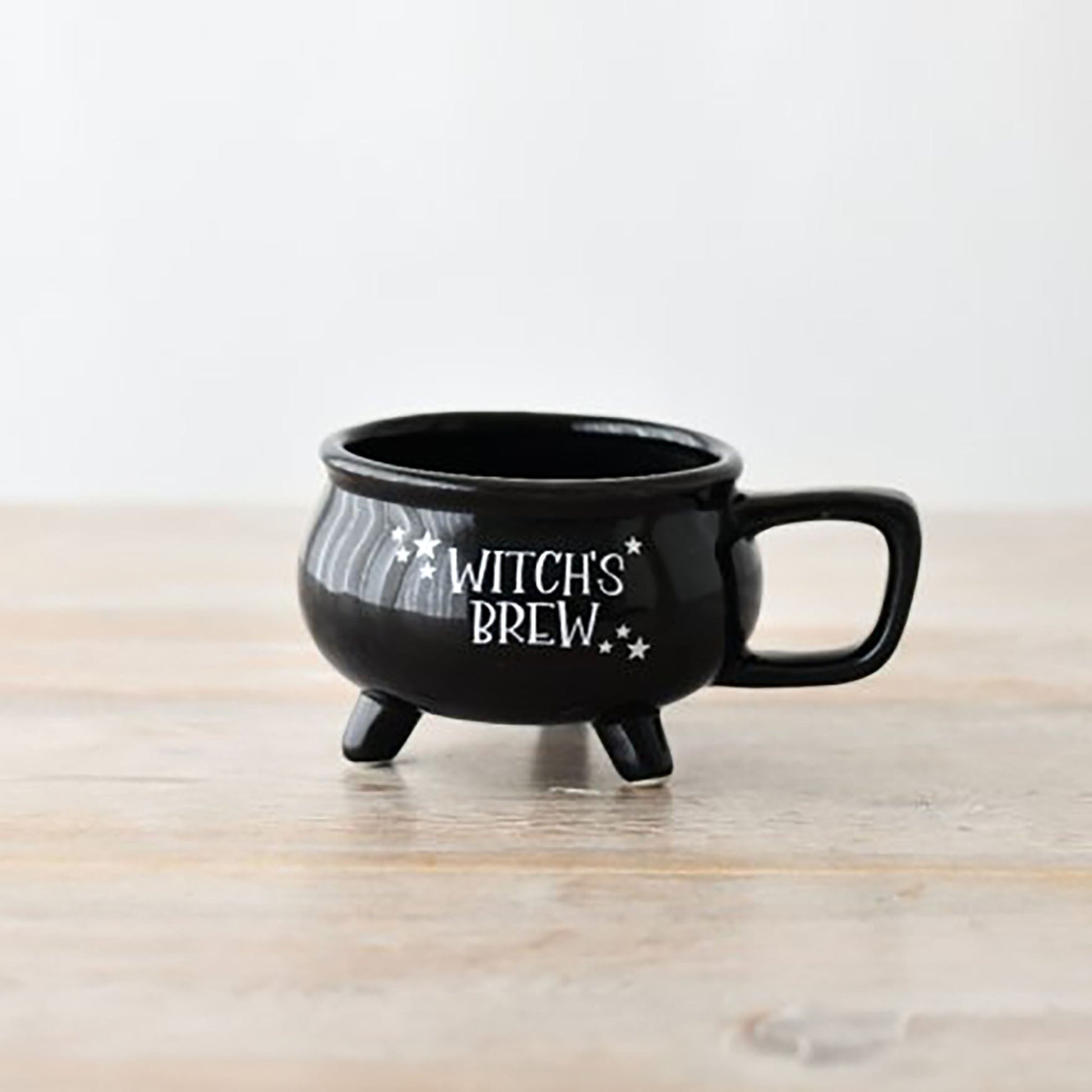 Black glossy Halloween witch's brew mug with gothic lettering design