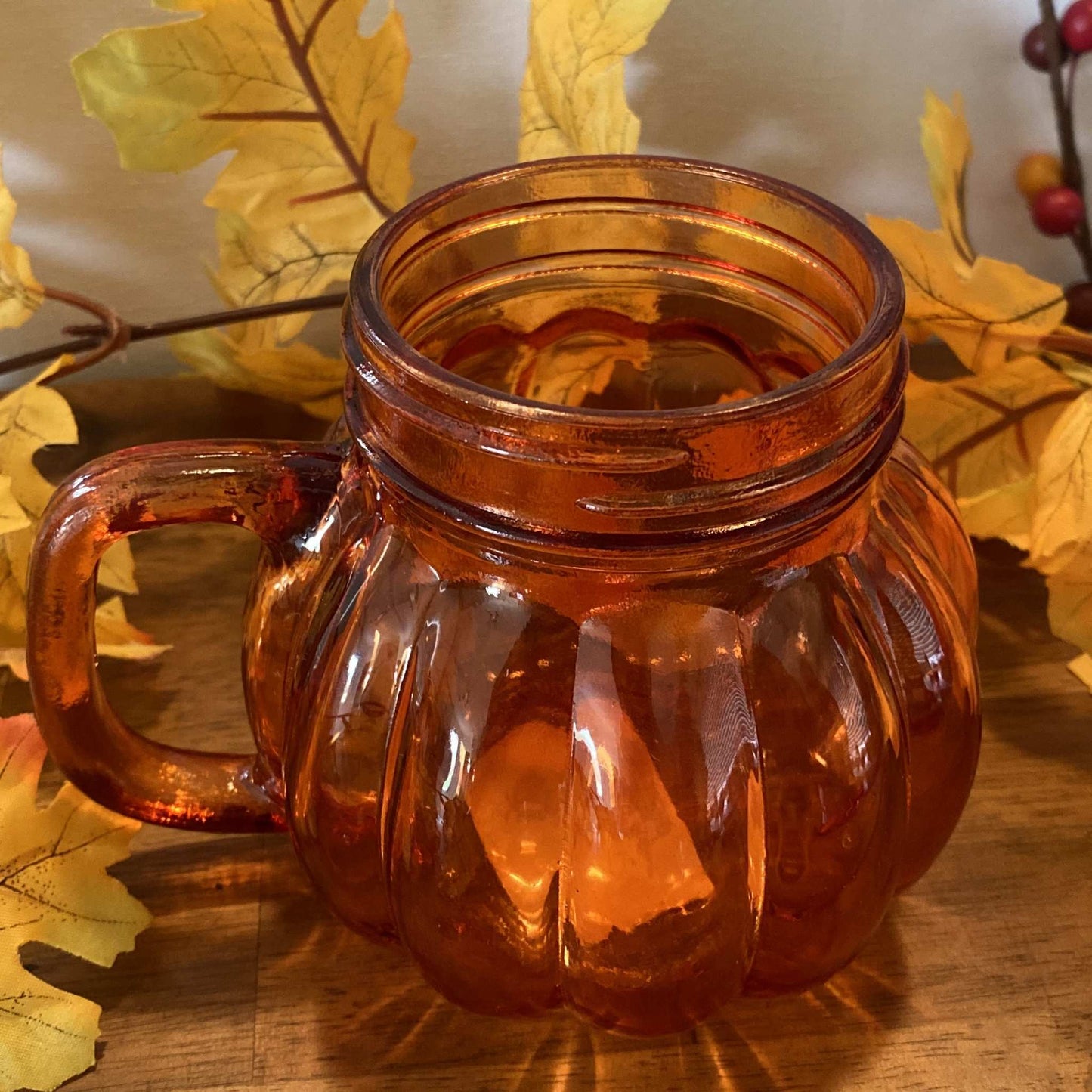 Close-up of ribbed glass texture and handle on pumpkin-shaped tumbler